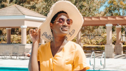 Woman Wearing Sun Hat and Sunglasses