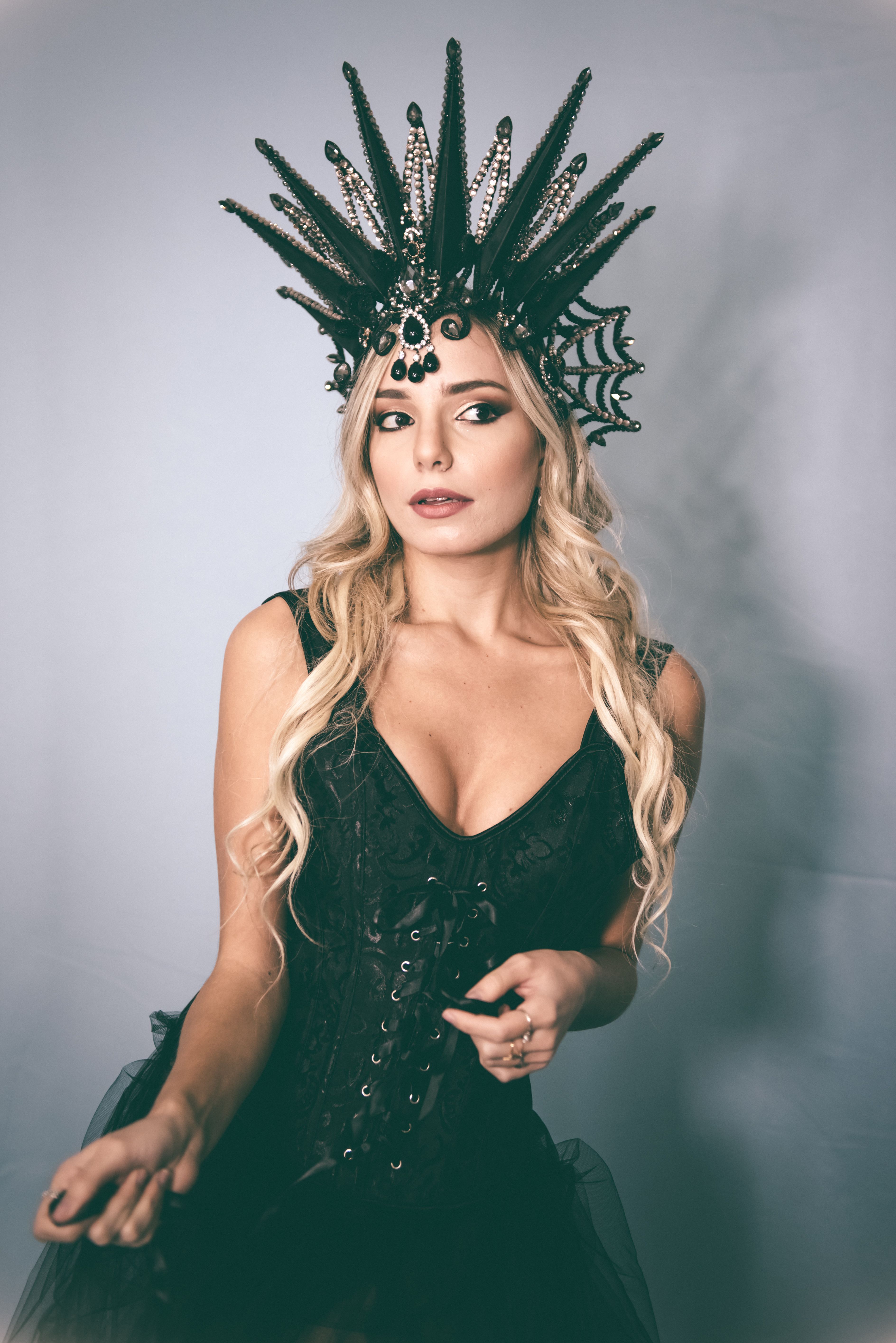 Portrait of Woman in Black Dress and Crown  Free Stock Photo