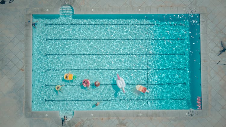 Top View Of People In The Swimming Pool