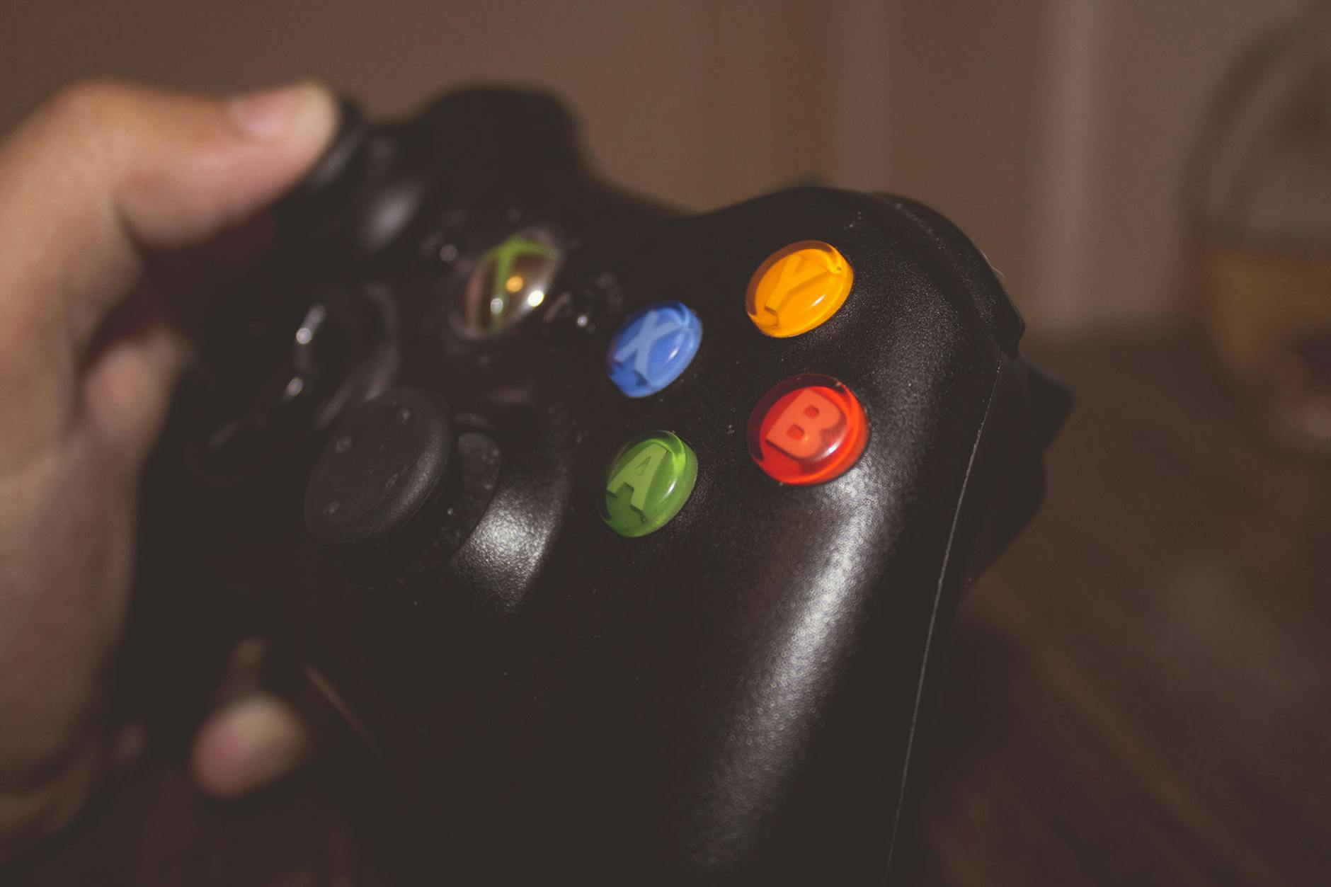 Person Holding Black Xbox One Controller