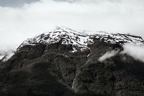 Grayscale Photo of Snowcapped Mountain