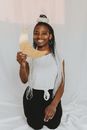 Woman Holding Gold Half Moon Paper Cutouts