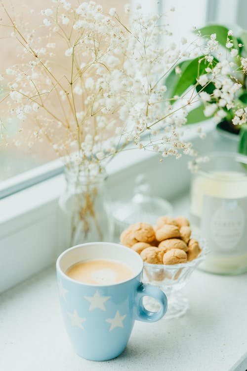 Mug of Fresh Coffee on a Window Sill