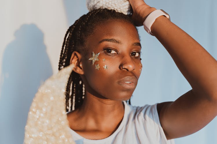 Woman With Cut Out Stars On Cheek