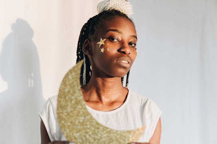 Woman With Gold Stars On Cheek