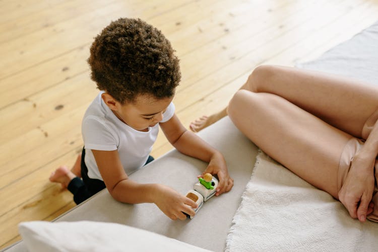 Boy Playing With Toy Cars