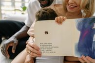 Big and Small Fingers Holding Book