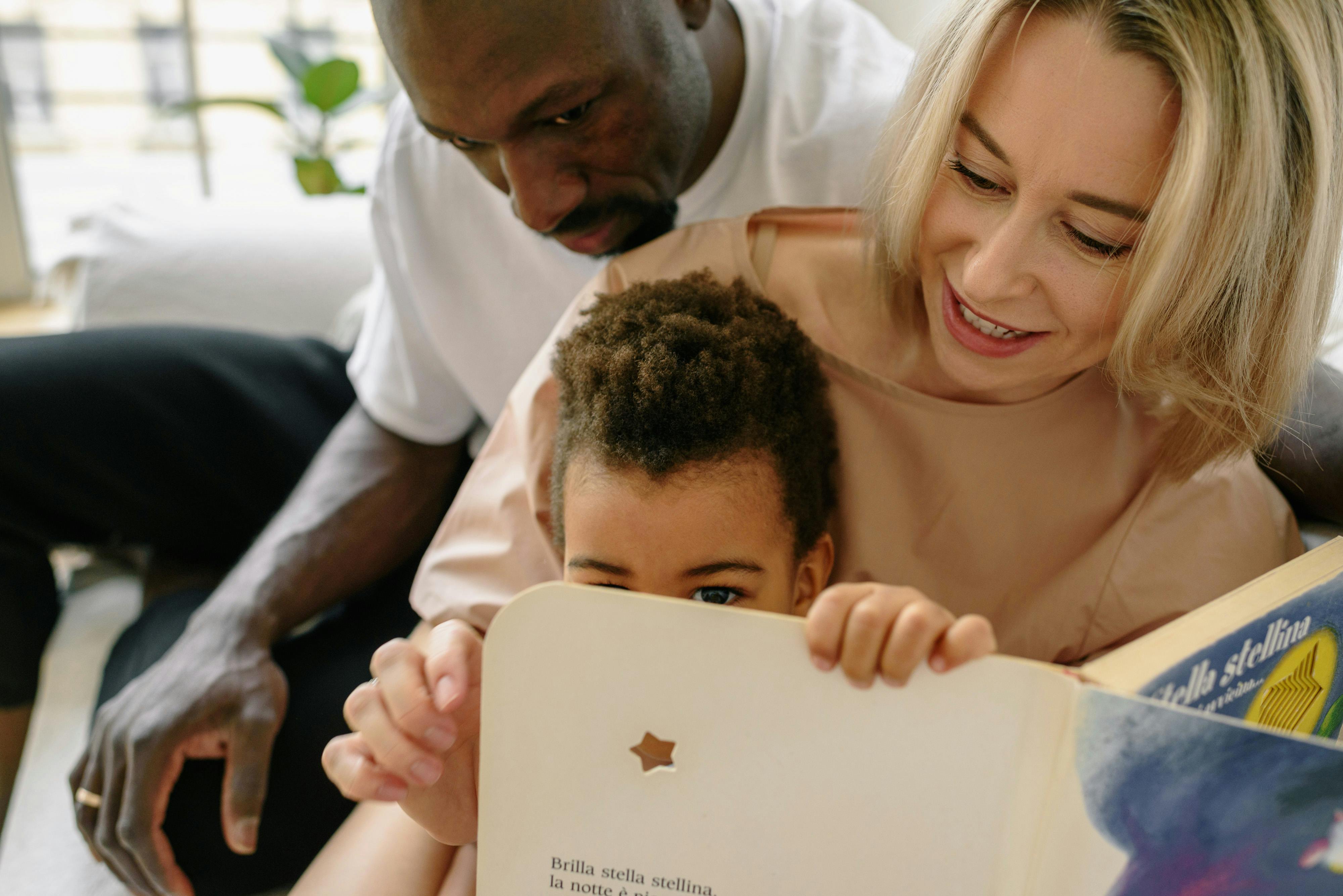 a family sitting on the couch