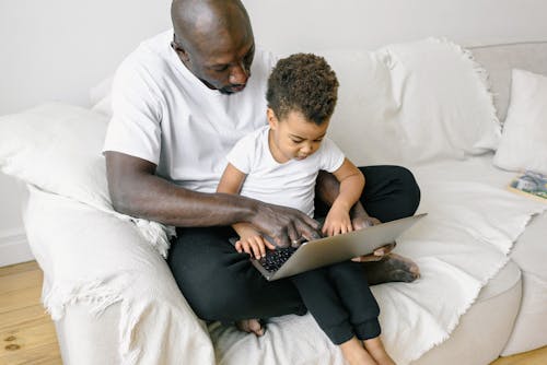 Free A Father and Son Using Laptop Together  Stock Photo