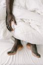 Black and Tan Short Coat Dog Lying on White Bed Linen