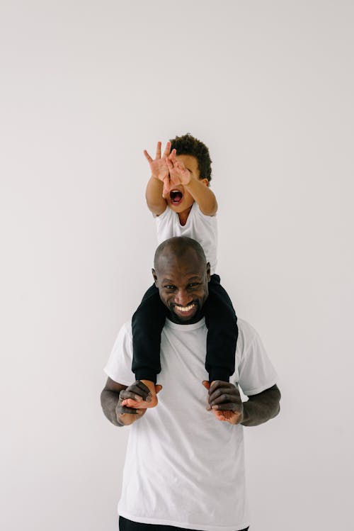 Man Carrying a Child on his Shoulder