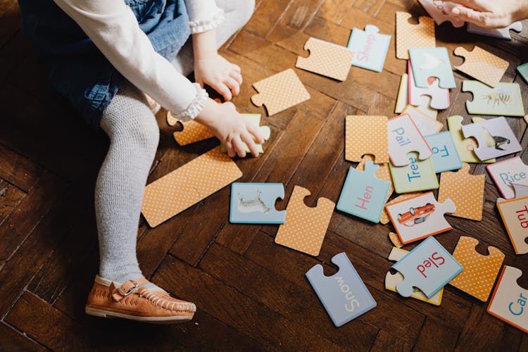 Person Playing With Puzzles