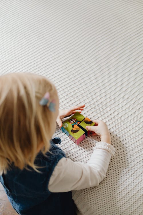 Free A Girl Playing a Puzzle Blocks Stock Photo