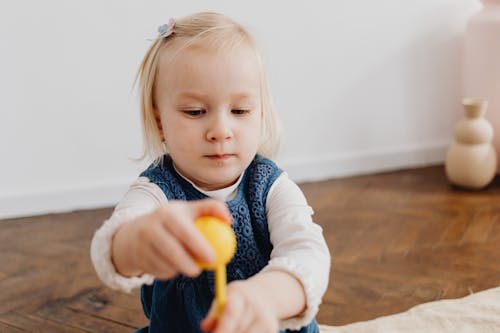 Free Girl Holding a Toy Stock Photo