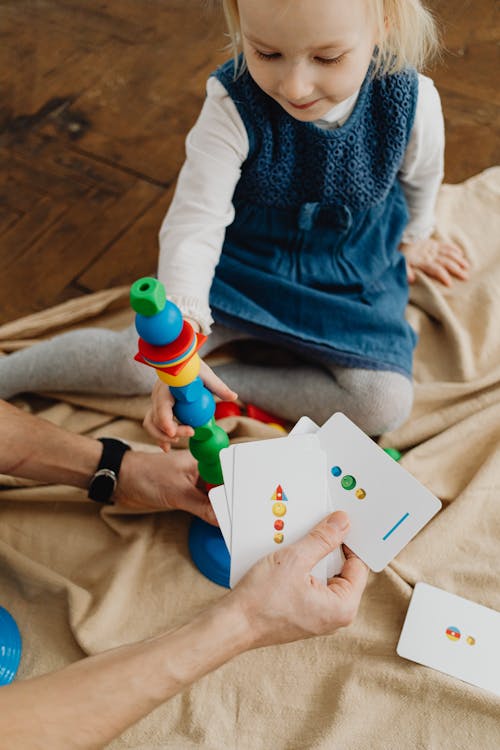 Free Girl Playing with a Toy Stock Photo