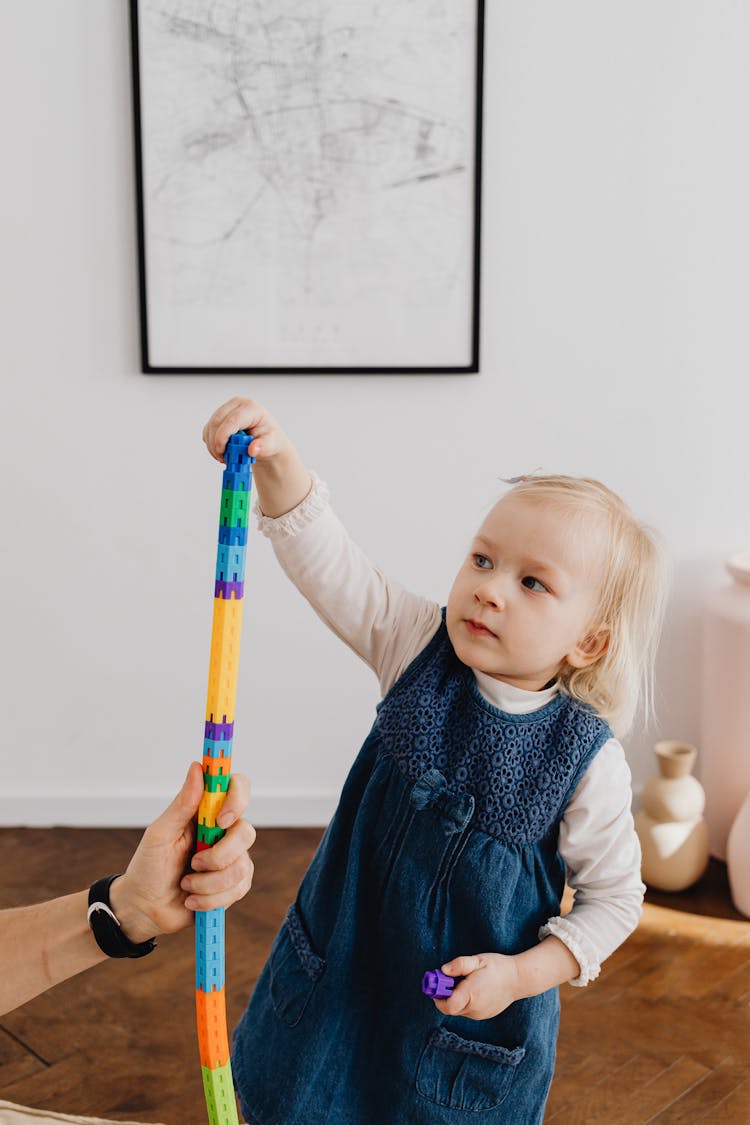 Girl Stacking Toys