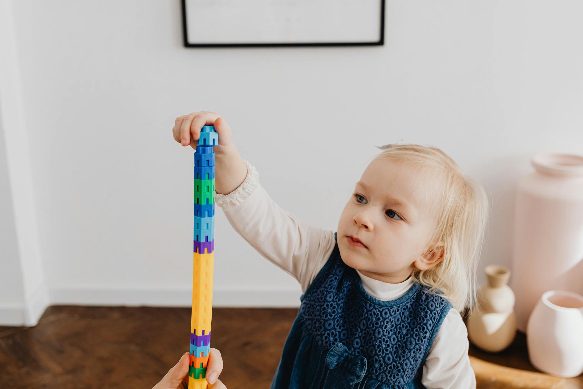 Girl Playing with Stacking Toy