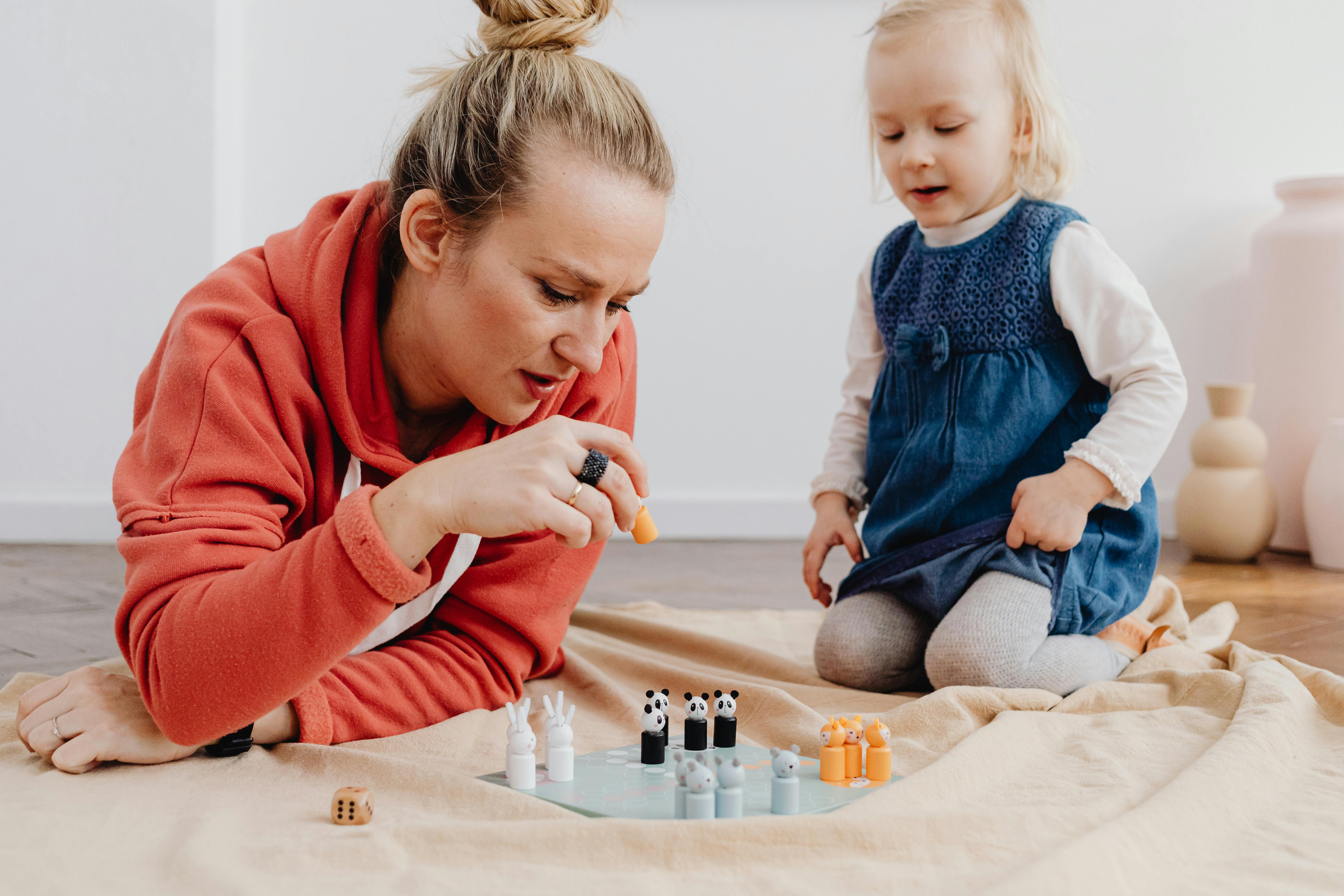 photo of a mother and her daughter playing together