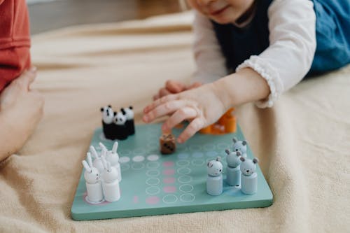 Child Playing Wooden Game