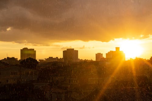 Free Sunset Behind the City Buildings Stock Photo