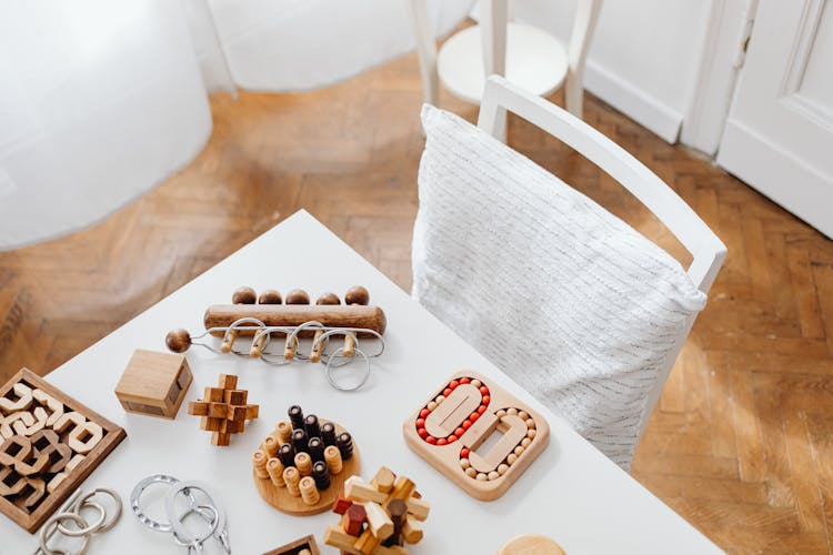 Photo Of Wooden Puzzles On A White Table