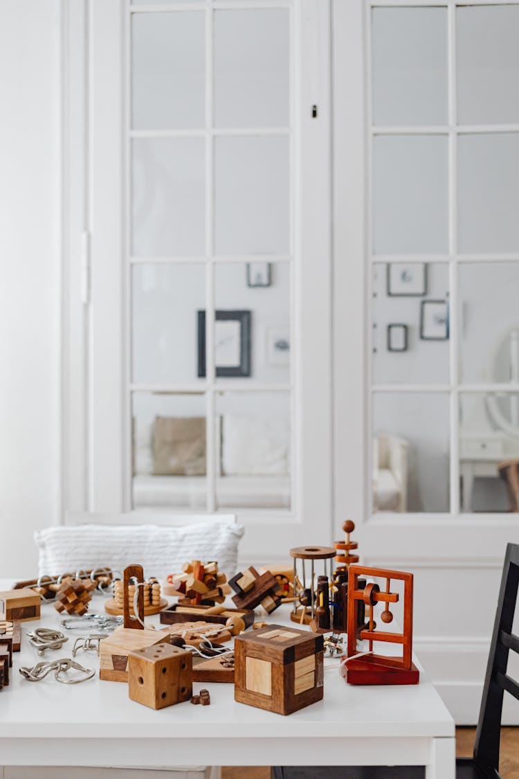 A White Table With Wooden Puzzles