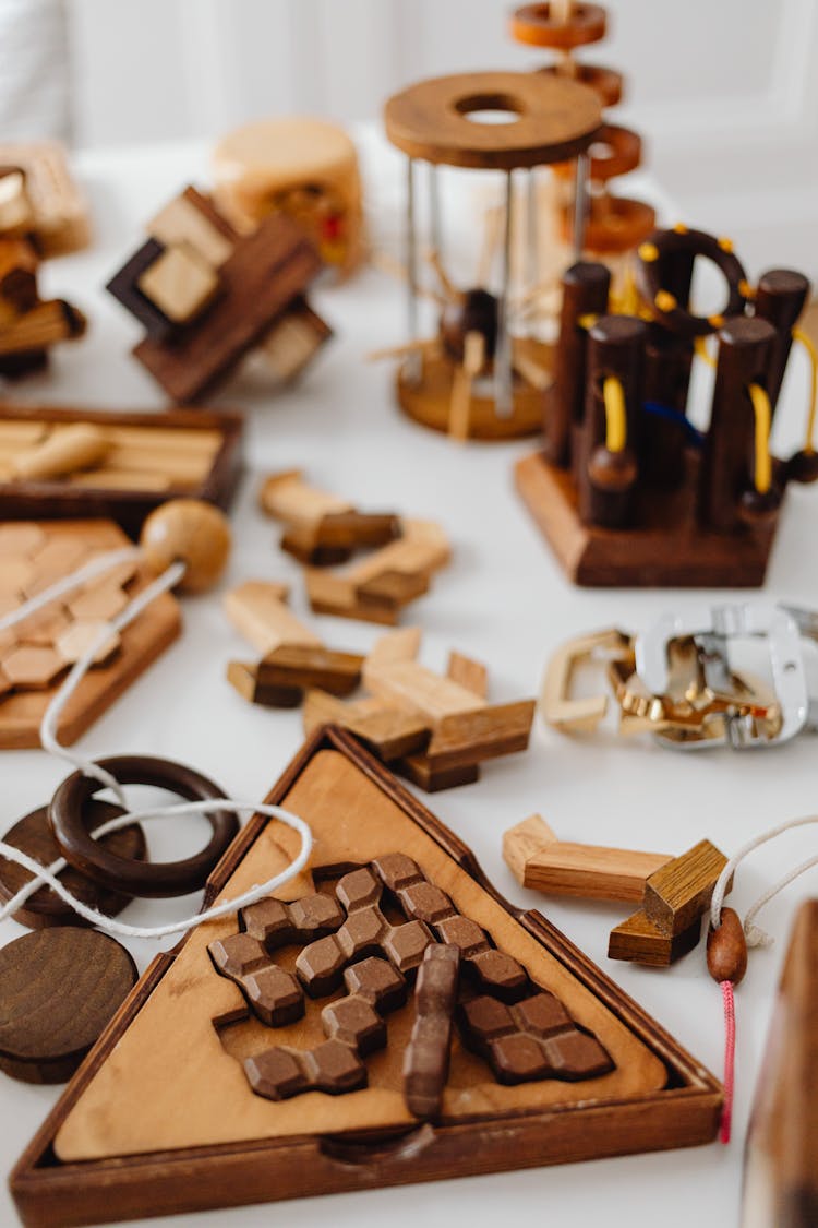 Brown Wooden Puzzles On A White Surface