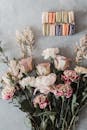 Box with sweet macaroons near tender fragrant bouquet