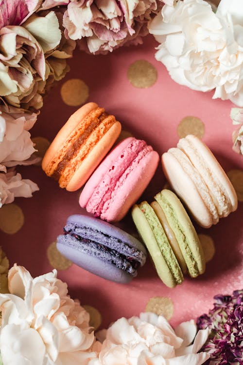A Colorful Macaroons Surrounded with Flowers