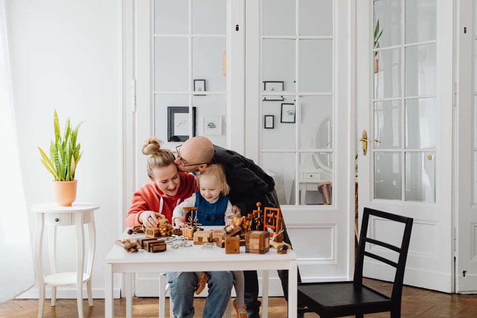 Photo by https://kaboompics.com/ on Pexels A loving family enjoying playtime with wooden toys in a cozy indoor setting. - Photo by https://kaboompics.com/ on Pexels