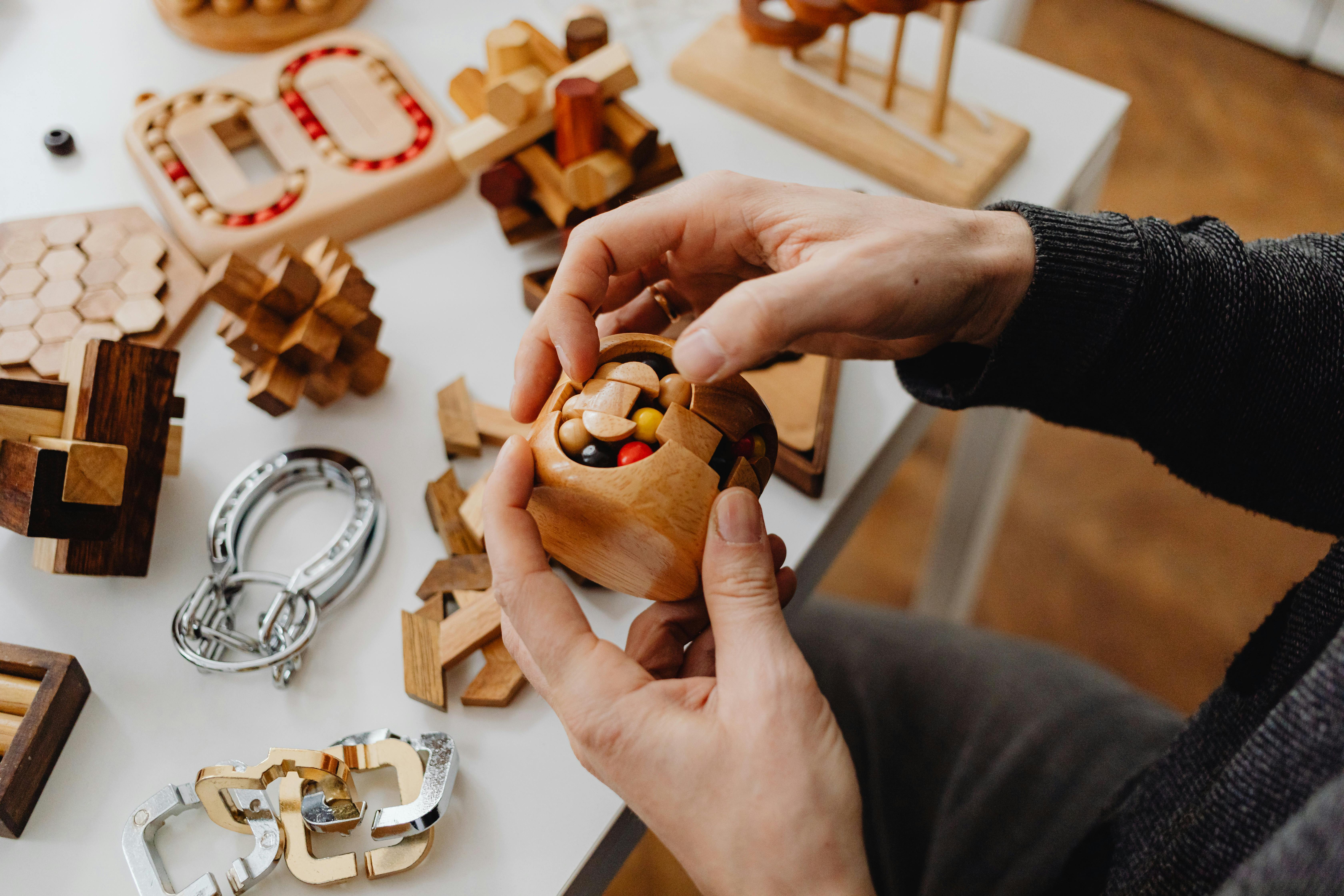 person holding a wooden toy