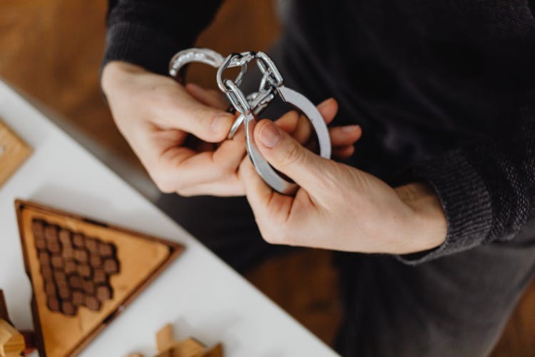 Person Holding Handcuffs 