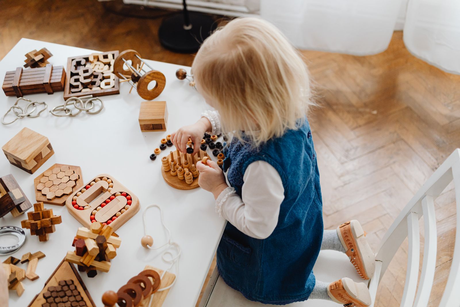 Wooden logic puzzles and brain teaser pieces arranged neatly for a focused tabletop activity