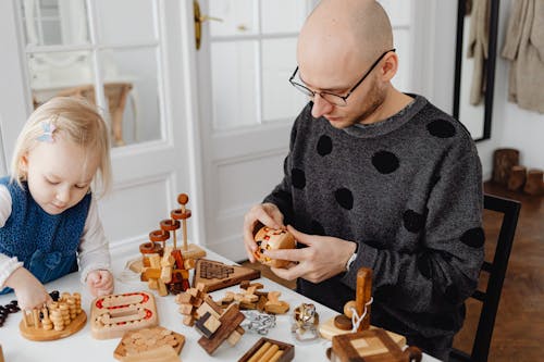Father and Child Playing Wooden Game Together