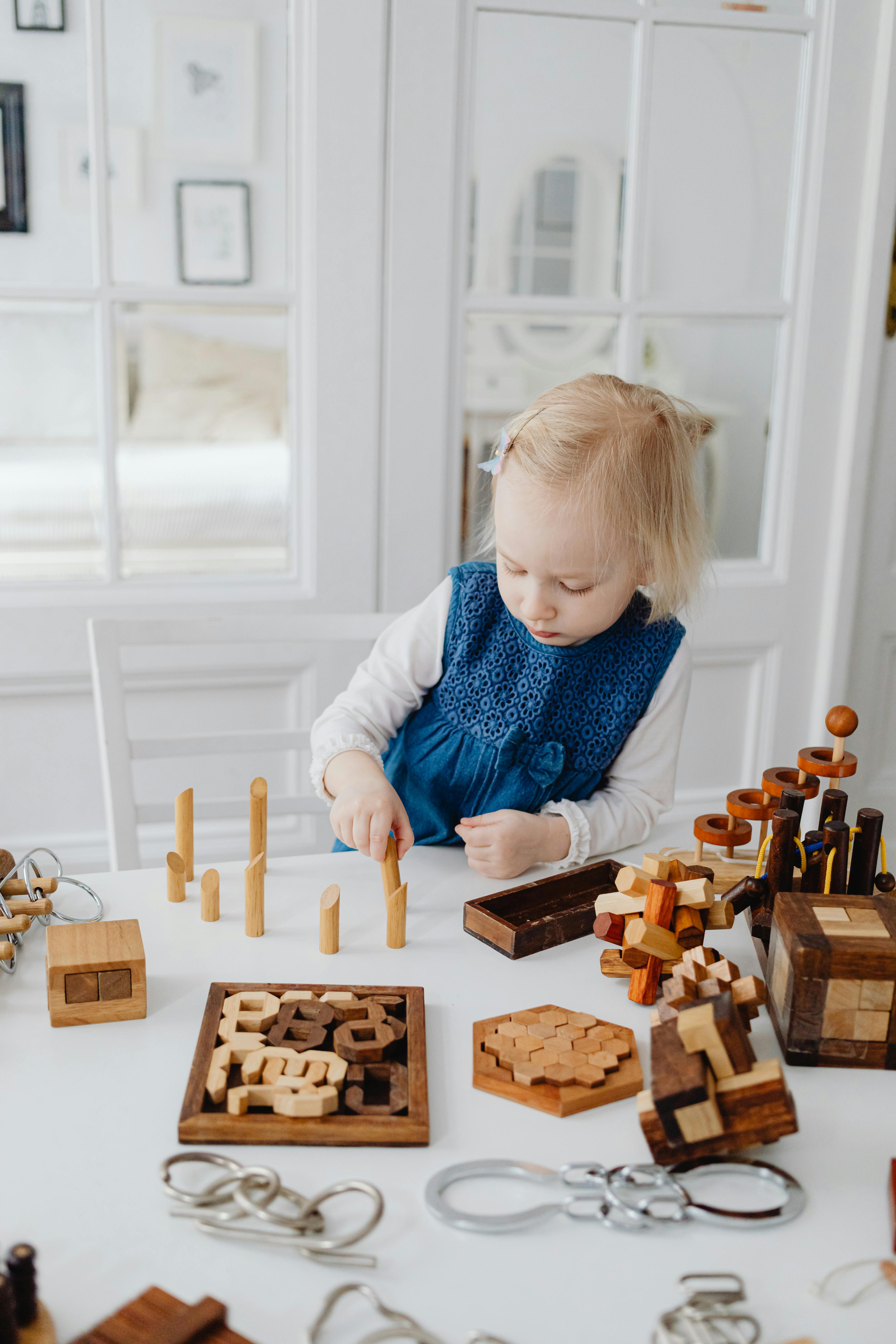 girl playing with toy blocks