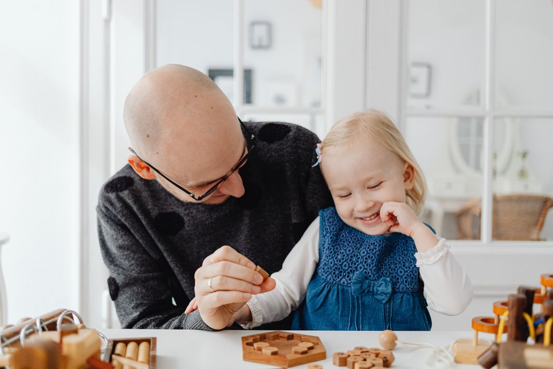 Parent and child sharing an educational activity together at home