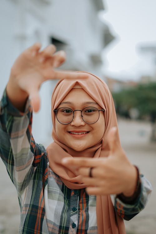 A Woman Wearing Glasses and Headscarf