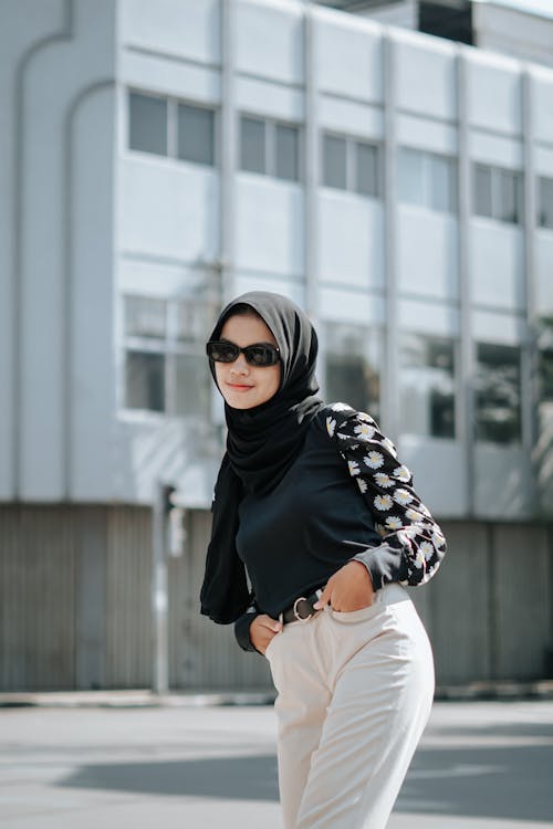 Woman in Black Hijab Posing While Hands in Pockets 