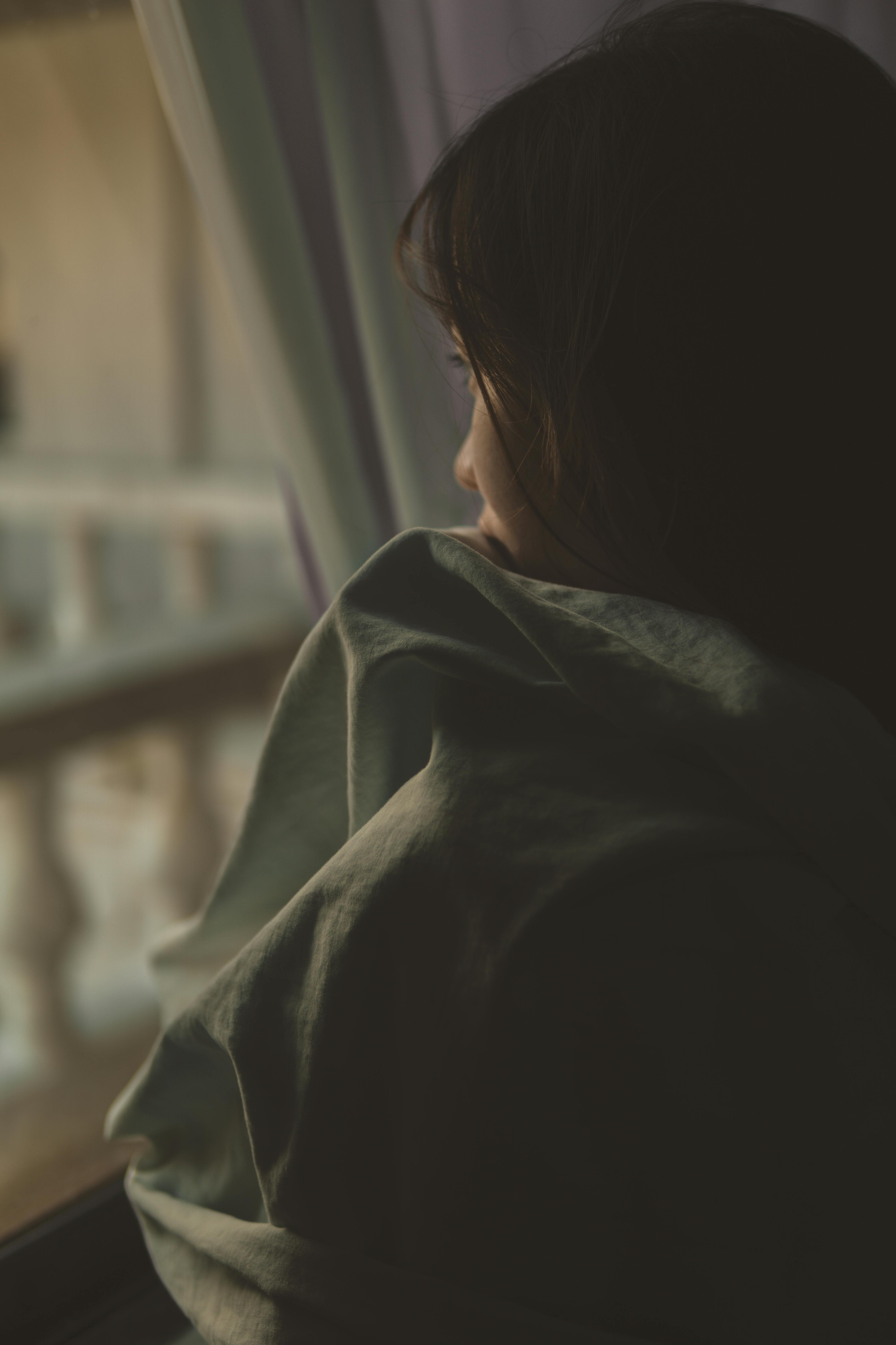 A Sad Girl Looking at the Window · Free Stock Photo