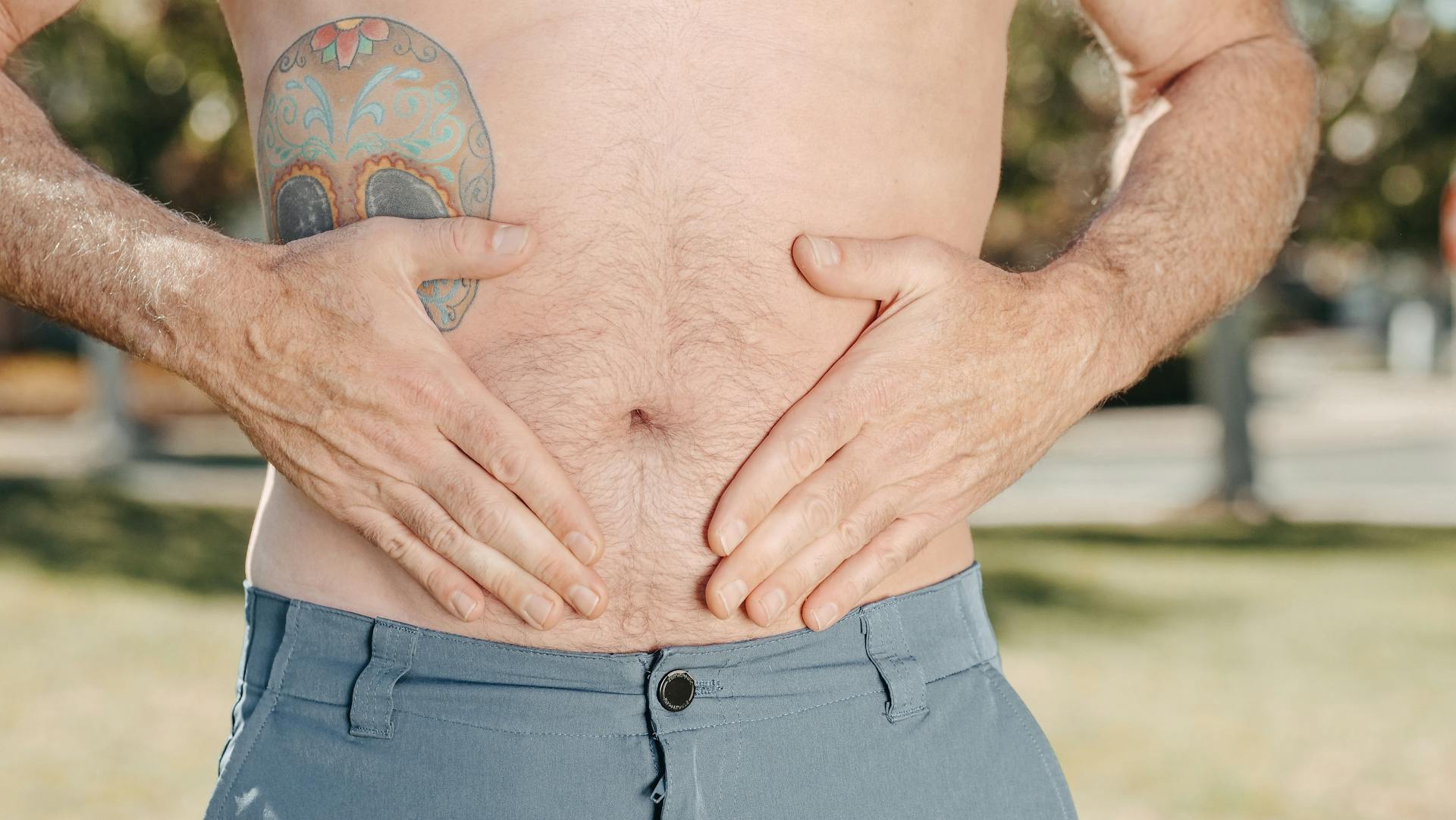 A Person Holding his Stomach