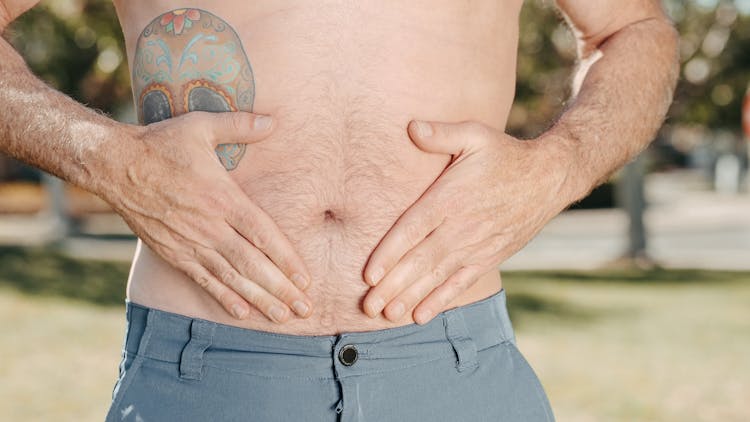 A Person Holding His Stomach