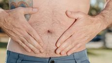 A Person Holding his Stomach