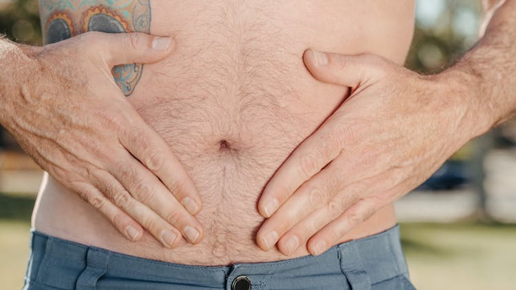 A Person Holding His Stomach