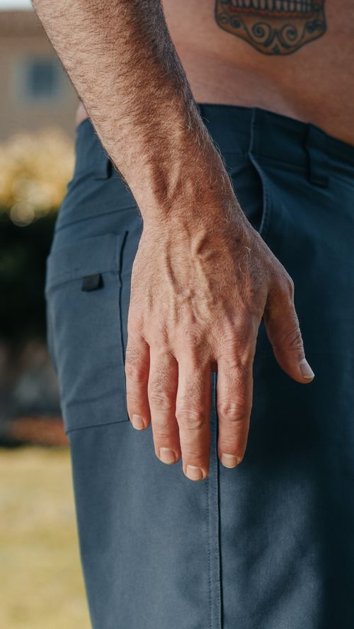 Free Detailed view of a man's hand with visible veins and tattoo, set outdoors. Stock Photo