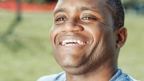 Free Close Up Photo of Smiling Man  Stock Photo