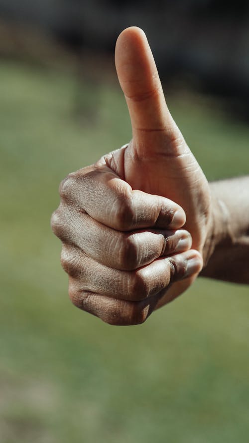 Free Close-up Shot of a Thumbs Up Stock Photo