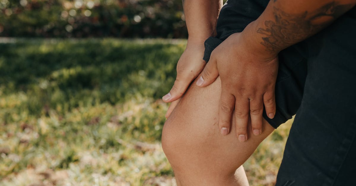 A person doing physical therapy exercises with a therapist to recover from a leg injury.