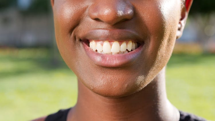 Close Up Photo Of Person's Smile 