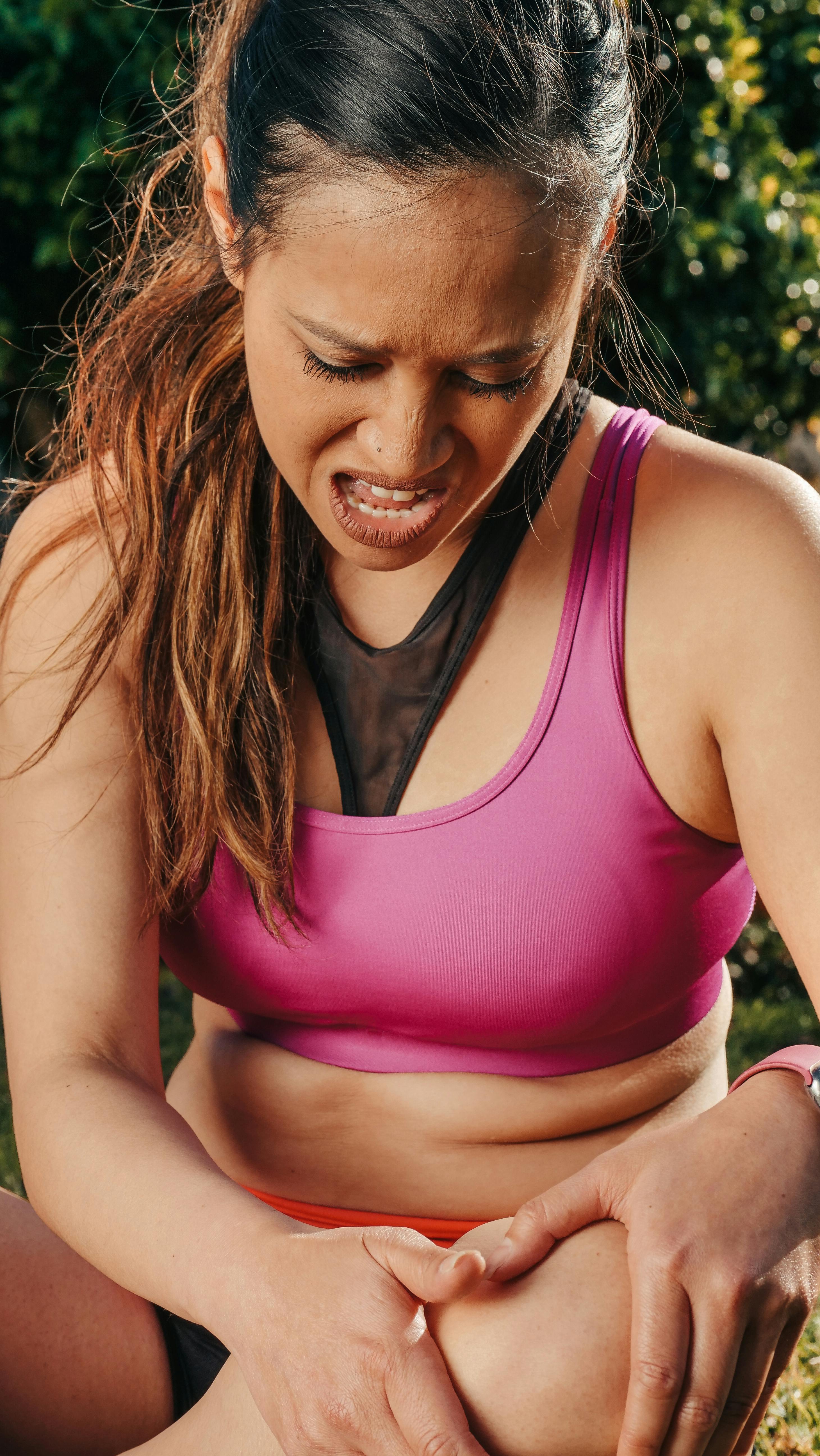 close up photo of woman having a knee pain