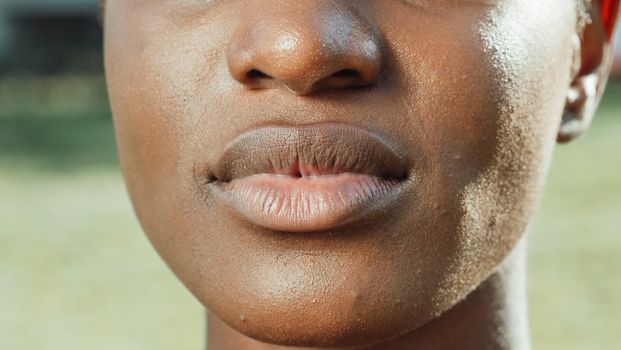 An extreme close-up shot highlighting facial features and texture.